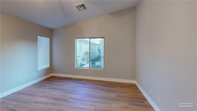 empty room featuring light hardwood / wood-style floors