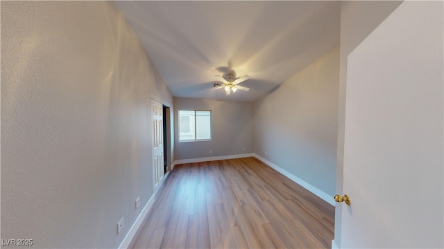 unfurnished room with ceiling fan and light wood-type flooring