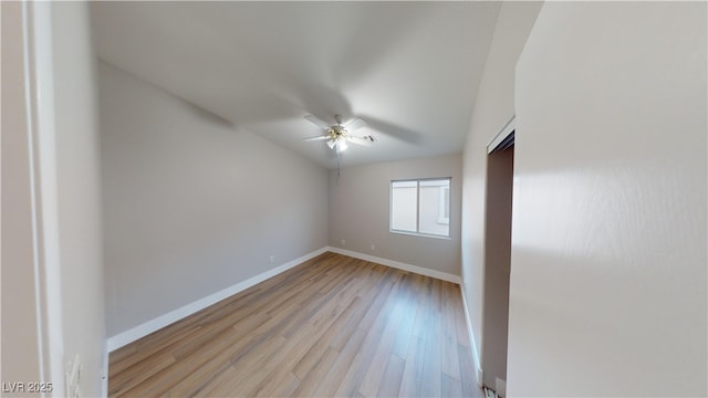 empty room featuring ceiling fan and light hardwood / wood-style flooring