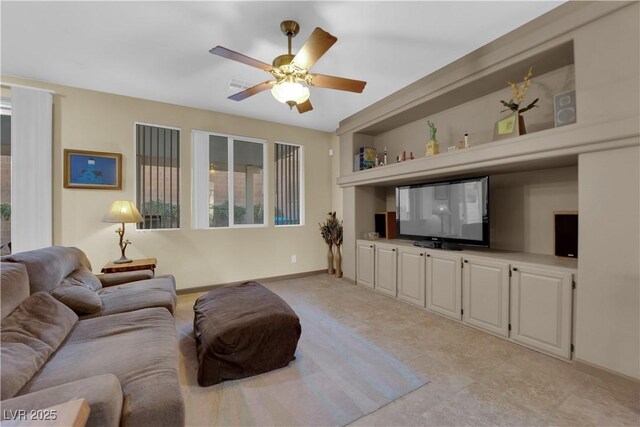 living room featuring ceiling fan