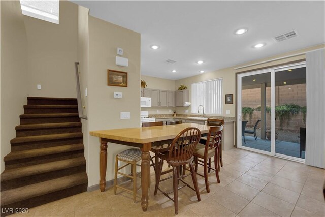 tiled dining space with sink