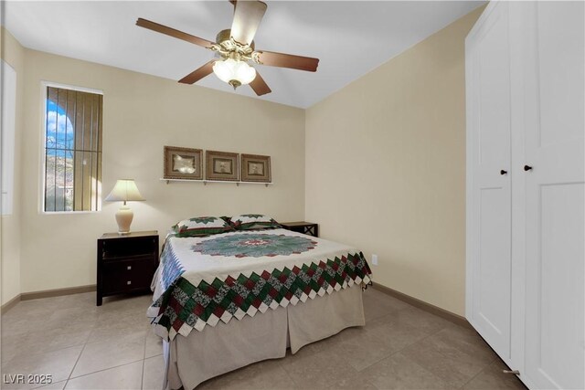 tiled bedroom with ceiling fan