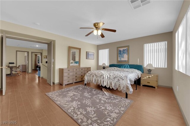 bedroom featuring light hardwood / wood-style floors and ceiling fan