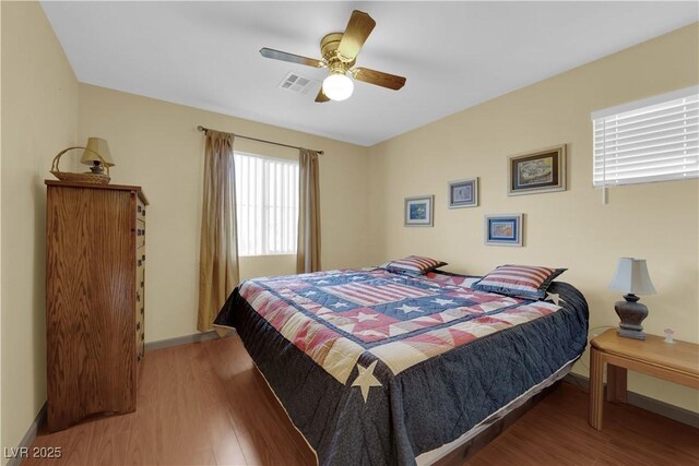 bedroom with wood-type flooring and ceiling fan