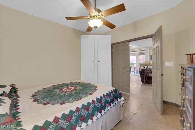 bedroom featuring light tile patterned floors and ceiling fan