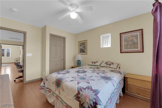 bedroom featuring light hardwood / wood-style flooring and ceiling fan