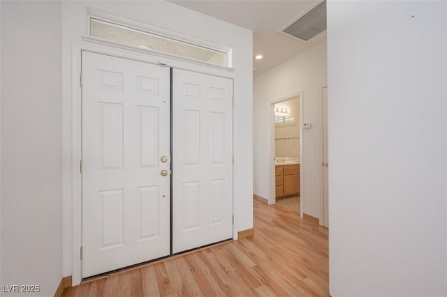 unfurnished bedroom with light wood-style floors, recessed lighting, visible vents, and baseboards