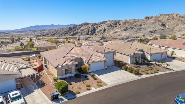 bird's eye view featuring a residential view and a mountain view