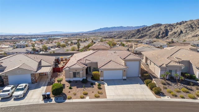 drone / aerial view with a residential view and a mountain view