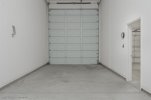 garage featuring baseboards