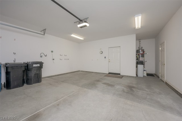 garage featuring water heater and a garage door opener