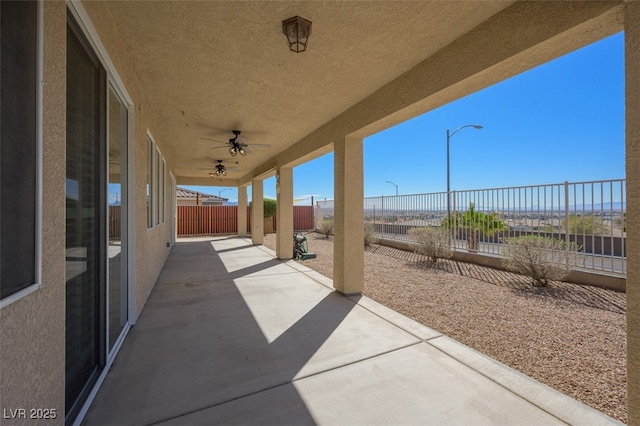 view of patio / terrace featuring a fenced backyard and a ceiling fan