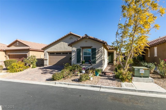 mediterranean / spanish-style home with a garage