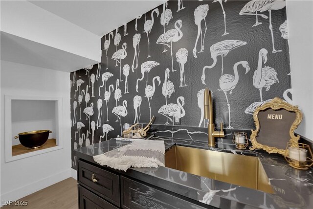 bathroom with hardwood / wood-style flooring and sink