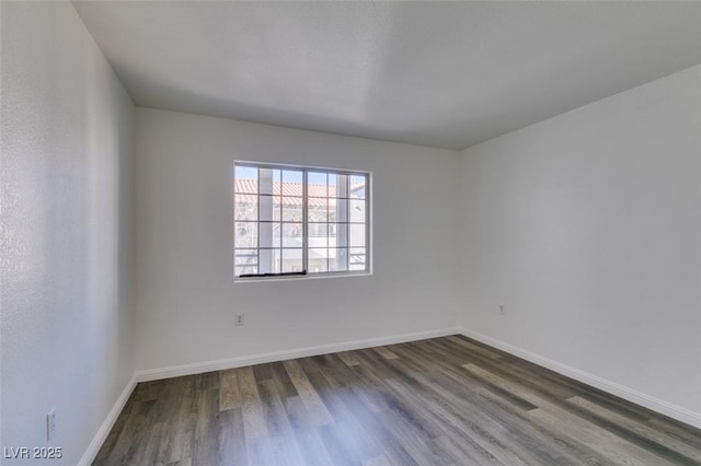 unfurnished room featuring dark hardwood / wood-style floors