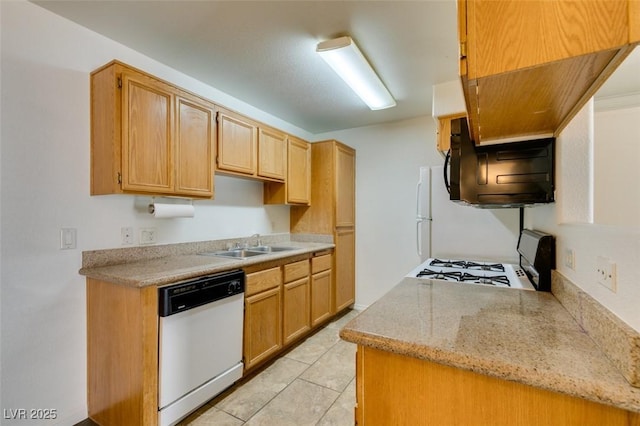 kitchen with white dishwasher, extractor fan, sink, range, and light tile patterned flooring