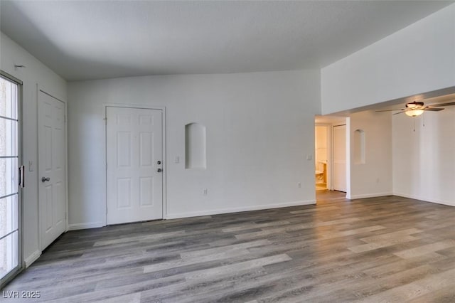 spare room featuring ceiling fan and light hardwood / wood-style flooring