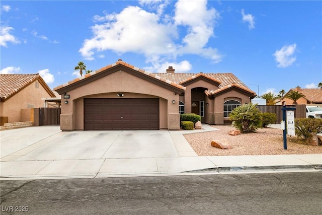 mediterranean / spanish-style house featuring a garage