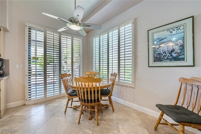 dining space with ceiling fan