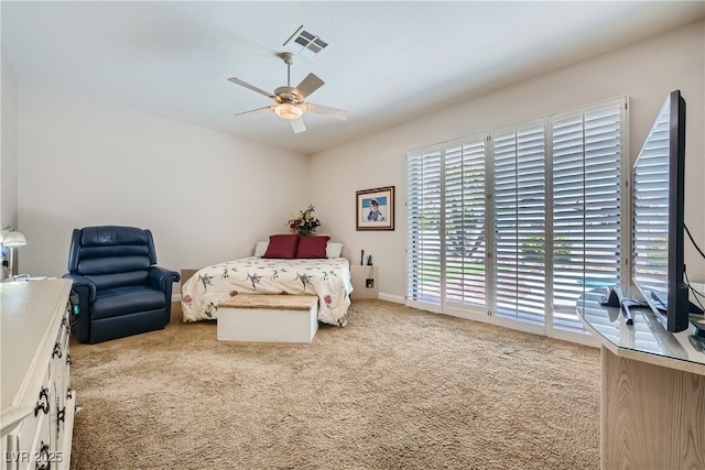 carpeted bedroom featuring ceiling fan and access to exterior