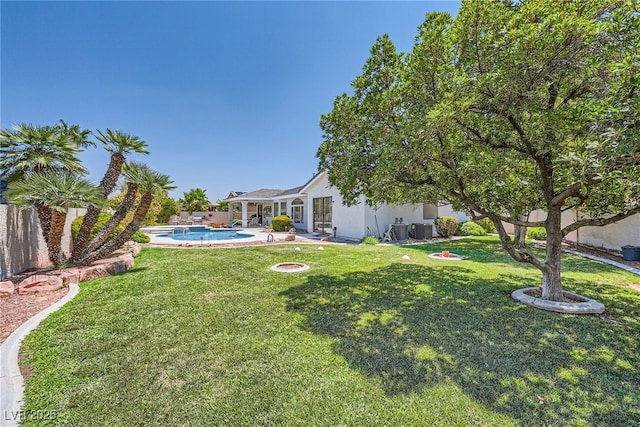 view of yard featuring a fenced in pool and a patio