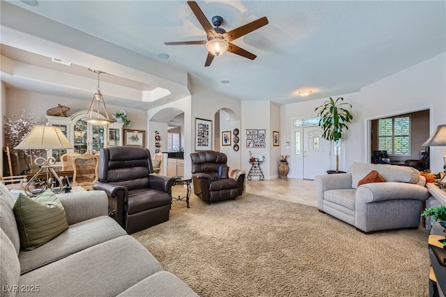 living room featuring ceiling fan and light colored carpet