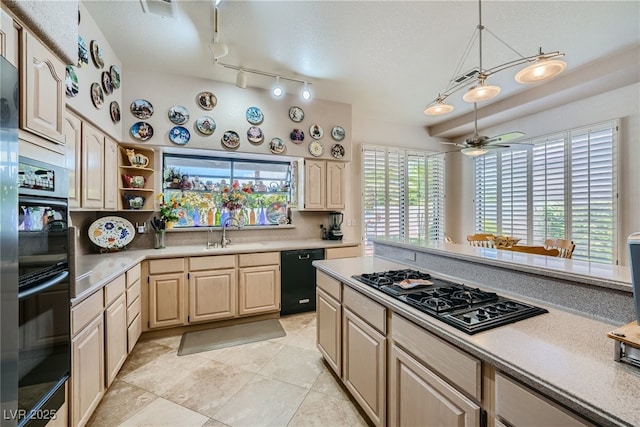 kitchen featuring black appliances, sink, ceiling fan, light brown cabinetry, and plenty of natural light