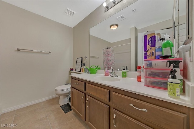 bathroom featuring tile patterned floors, a shower with curtain, vanity, and toilet