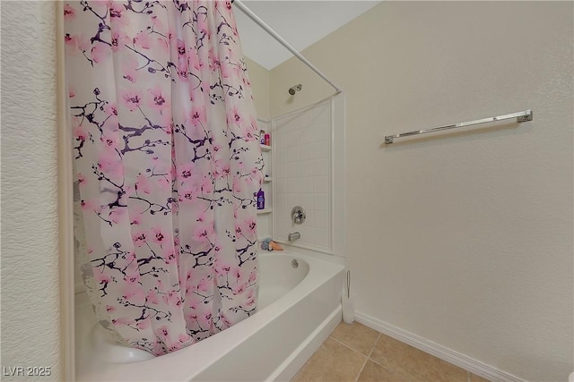 bathroom with shower / bath combination with curtain and tile patterned floors