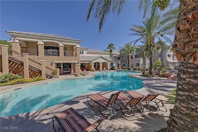 view of swimming pool with a patio area