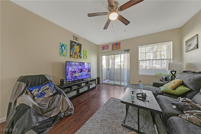 living room featuring dark hardwood / wood-style flooring and ceiling fan