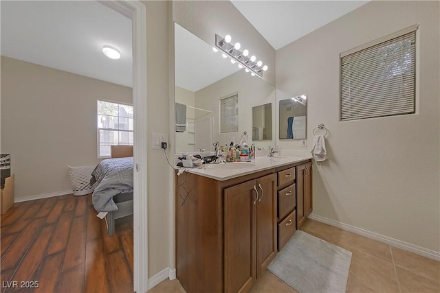 bathroom featuring hardwood / wood-style floors and vanity