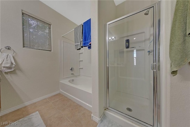 bathroom with tile patterned flooring and independent shower and bath