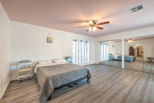 bedroom featuring hardwood / wood-style floors and ceiling fan