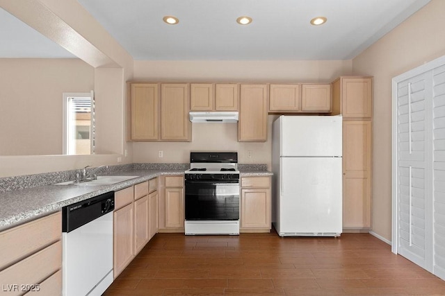 kitchen featuring light brown cabinetry, sink, white appliances, and dark hardwood / wood-style floors