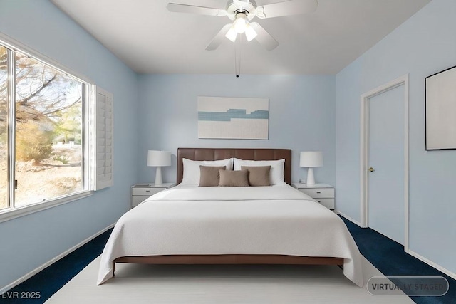 carpeted bedroom with ceiling fan