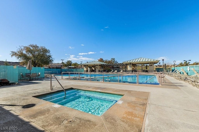 view of pool with a patio area and a community hot tub