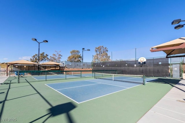 view of sport court with basketball hoop