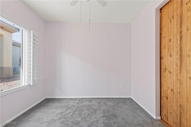 spare room featuring carpet and ceiling fan