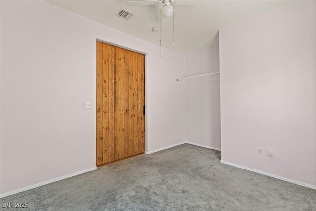 empty room with carpet floors and ceiling fan