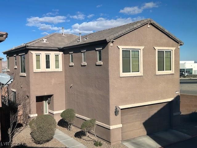 view of property exterior featuring a garage