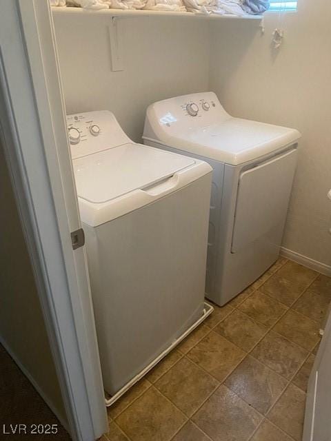 washroom featuring washer and clothes dryer