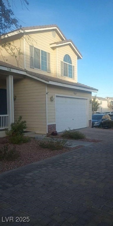 view of property exterior with a garage