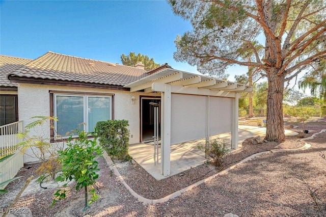 view of front of house featuring a patio area and a pergola