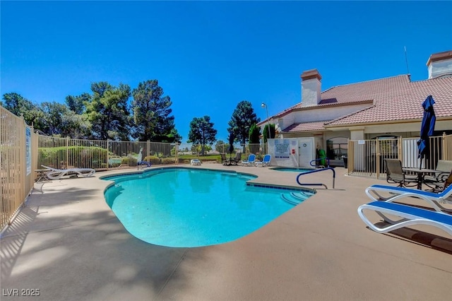 view of pool featuring a patio area