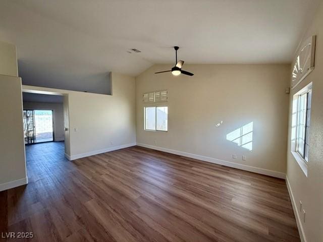 unfurnished living room with dark hardwood / wood-style floors, ceiling fan, and lofted ceiling