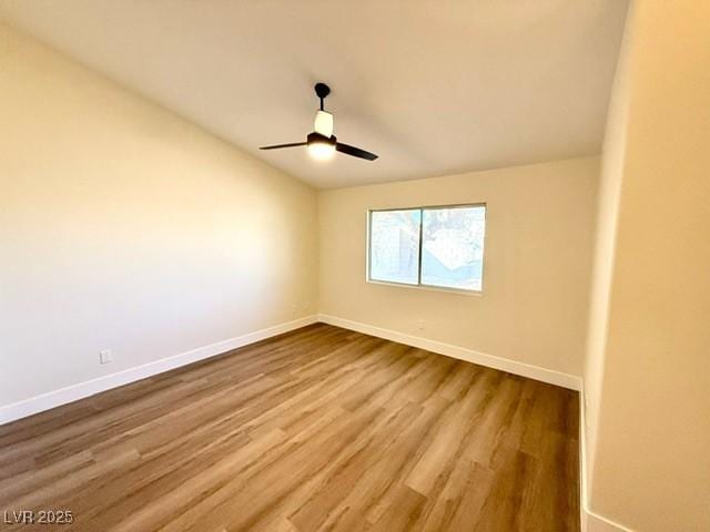 spare room featuring ceiling fan and wood-type flooring