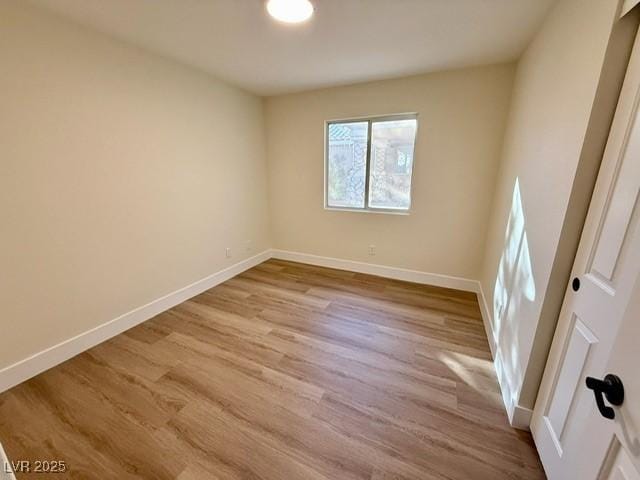 empty room with light wood-type flooring