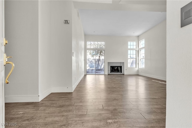 unfurnished living room featuring hardwood / wood-style flooring