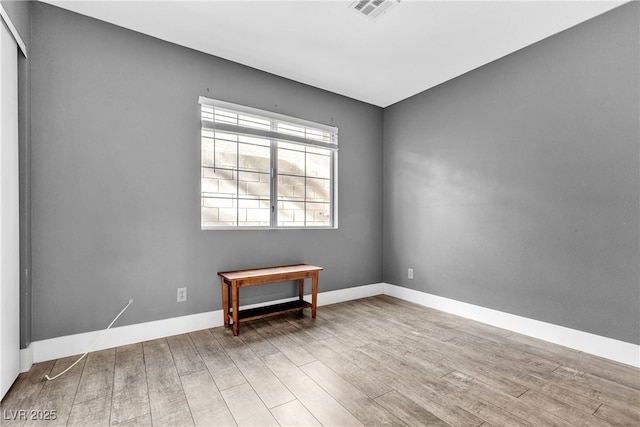 empty room featuring wood-type flooring